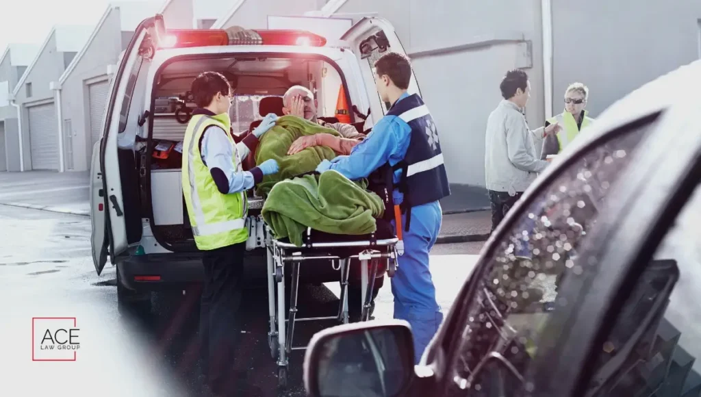 A person being taken inside the ambulance after a car accident