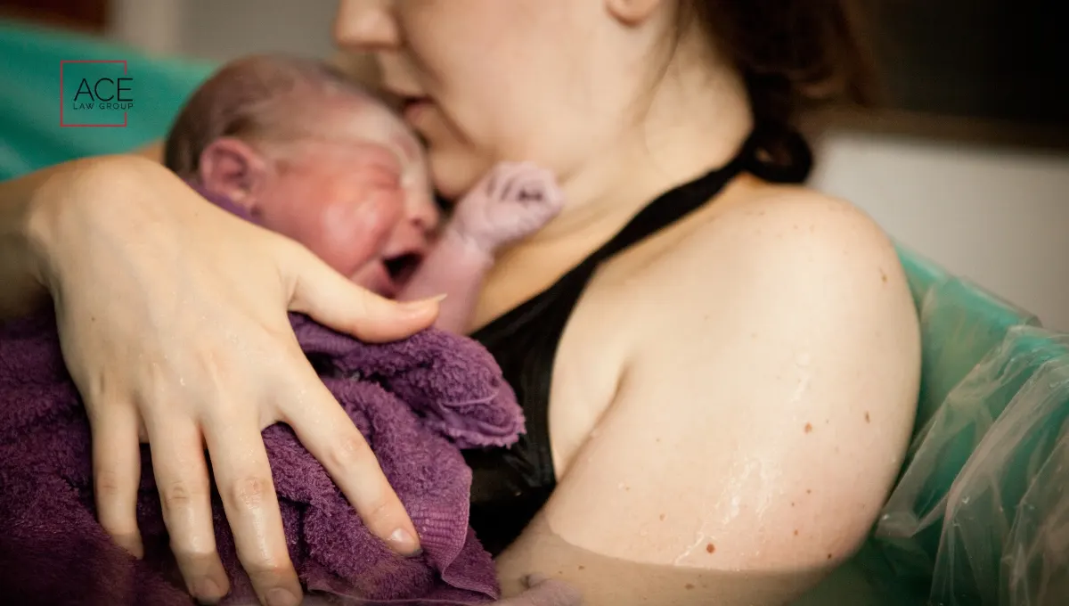Mother holding newborn after birth injury